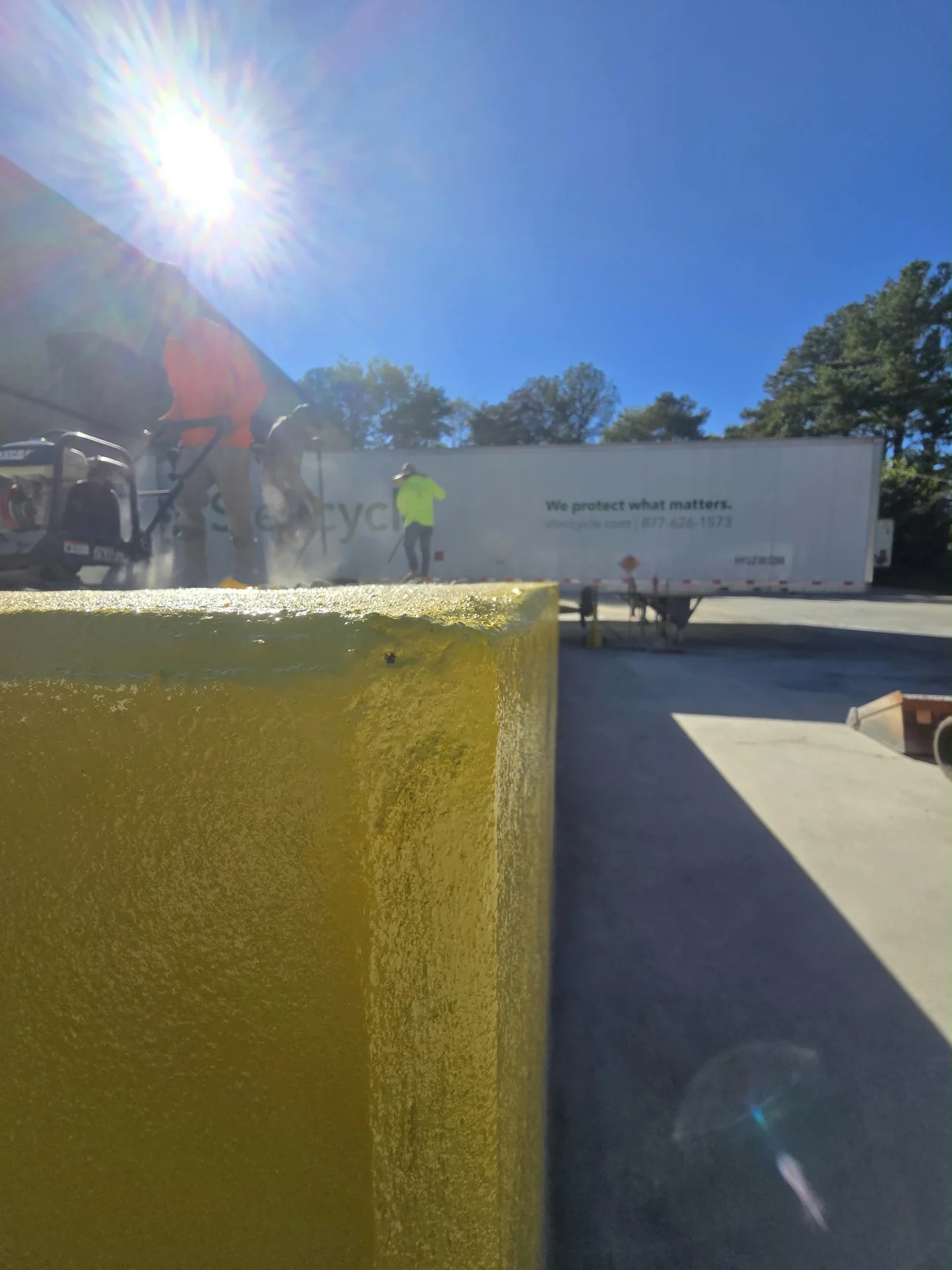 Close-up of the yellow-painted concrete wall edge